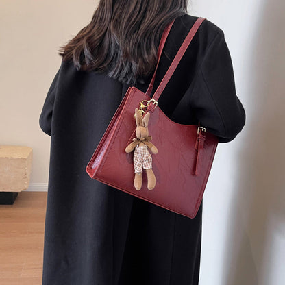 🎅Christmas Carnival Delivery🥳Women's Trendy Shoulder Bag with Doll Pendant